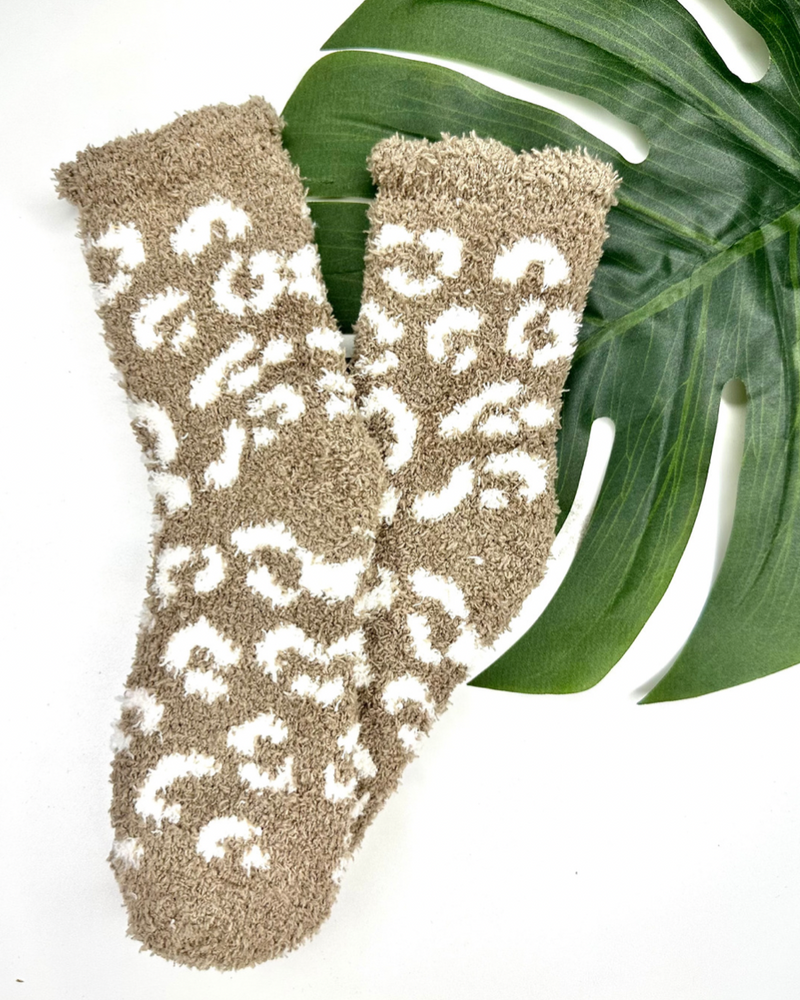 ultra-soft fuzzy socks with a playful animal print in tan