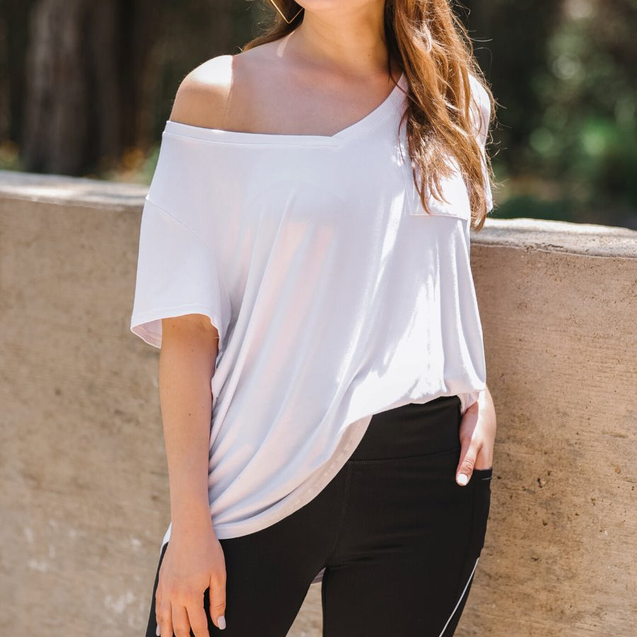 sleek black biker shorts created from lightweight stretch fabric with a white piping, high elastic waistband for tummy control, side pockets, a flattering figure-hugging short silhouette, above-knee length, and pull-on design