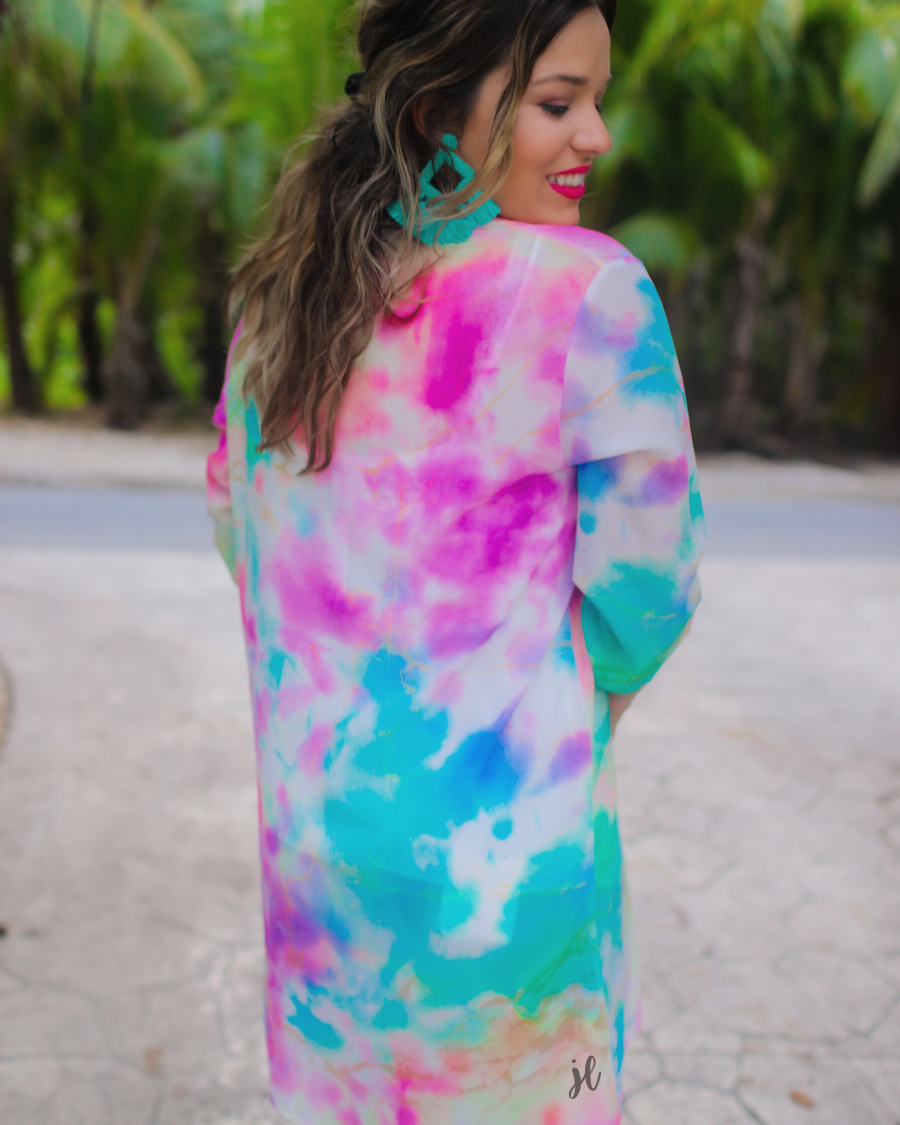 half-sleeve open front kimono made of lightweight material with a relaxed fit on a multi-colored tie-dye print pattern fabric