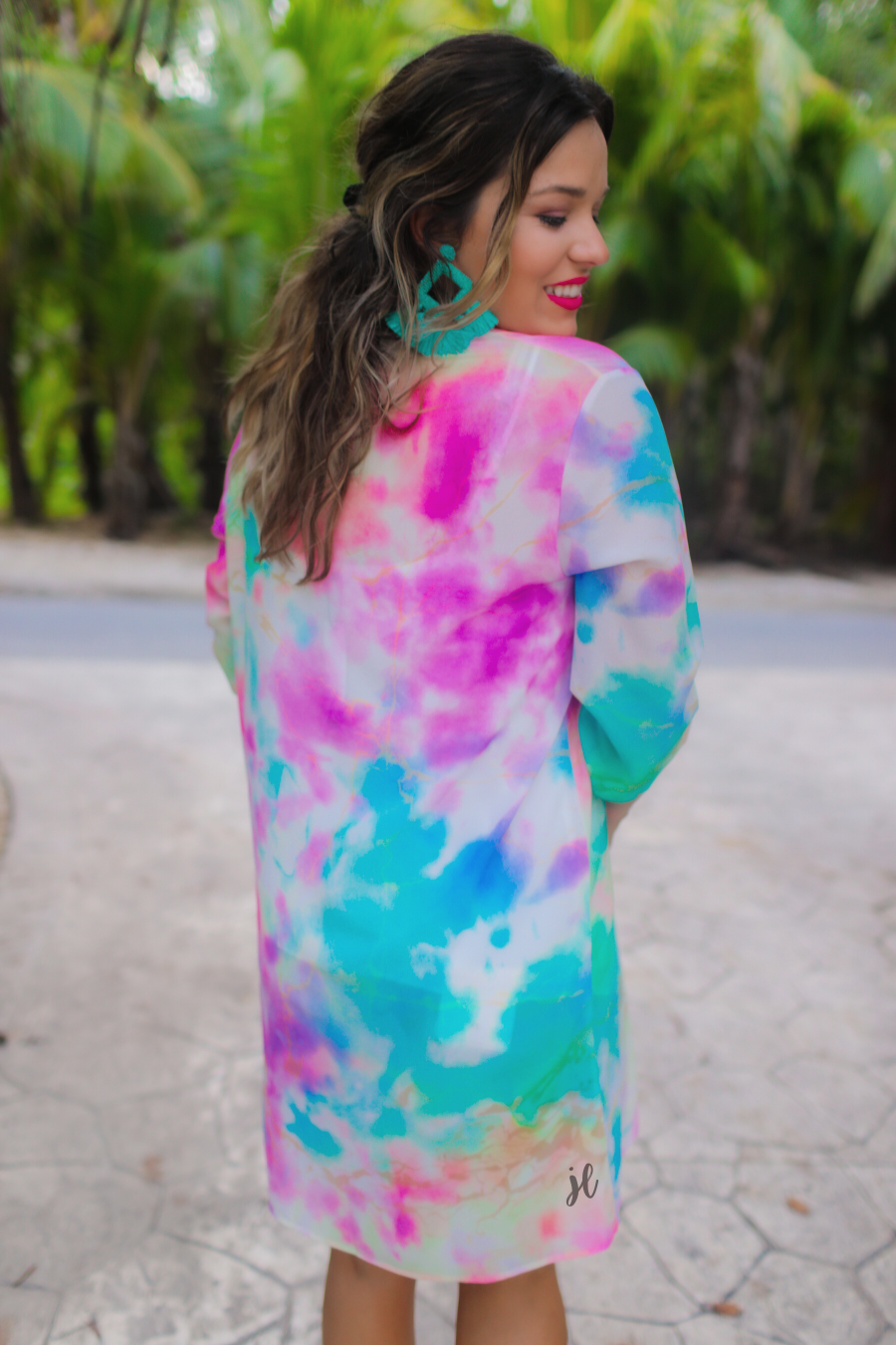 half-sleeve open front kimono made of lightweight material with a relaxed fit on a multi-colored tie-dye print pattern fabric