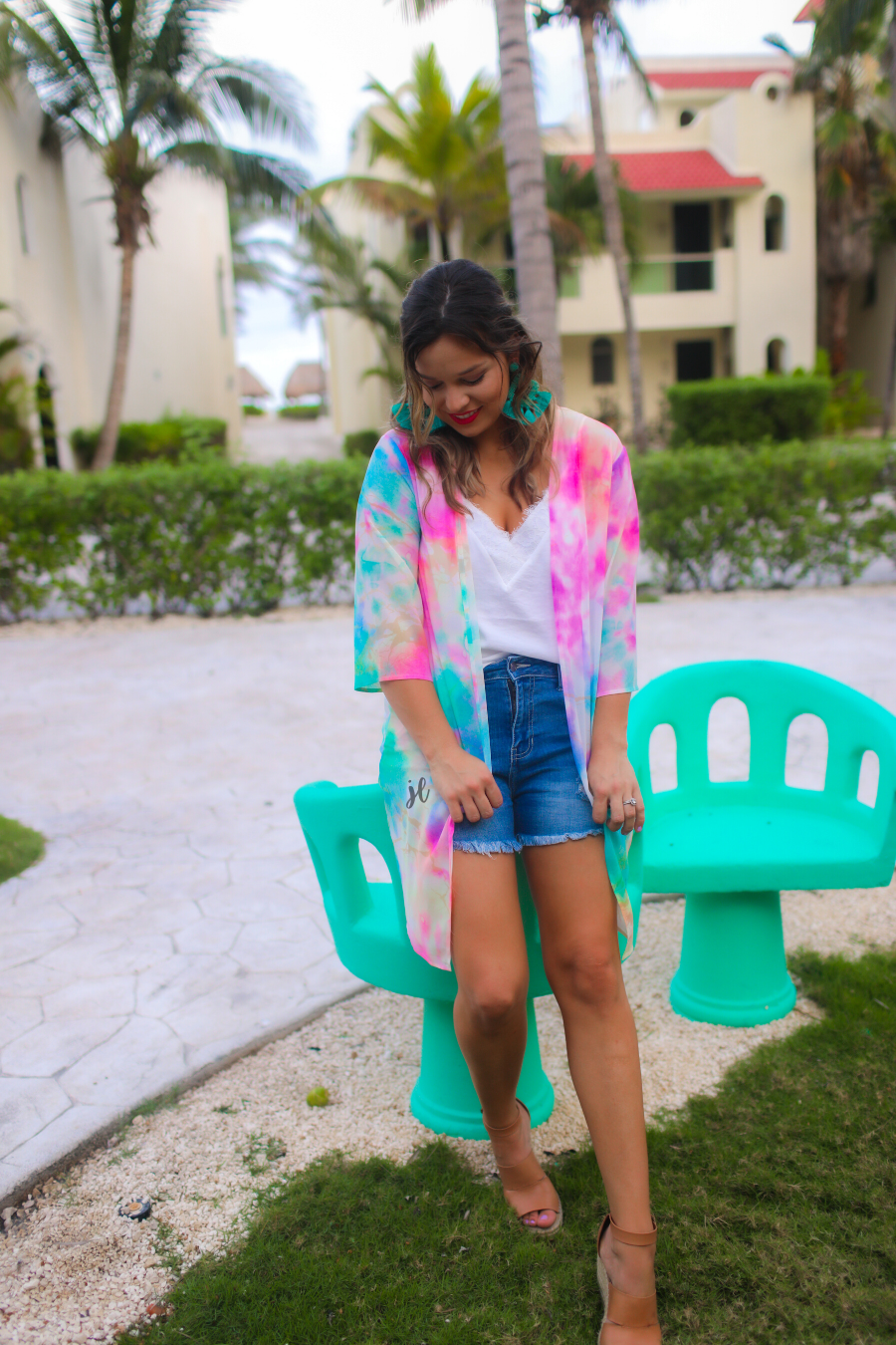half-sleeve open front kimono made of lightweight material with a relaxed fit on a multi-colored tie-dye print pattern fabric