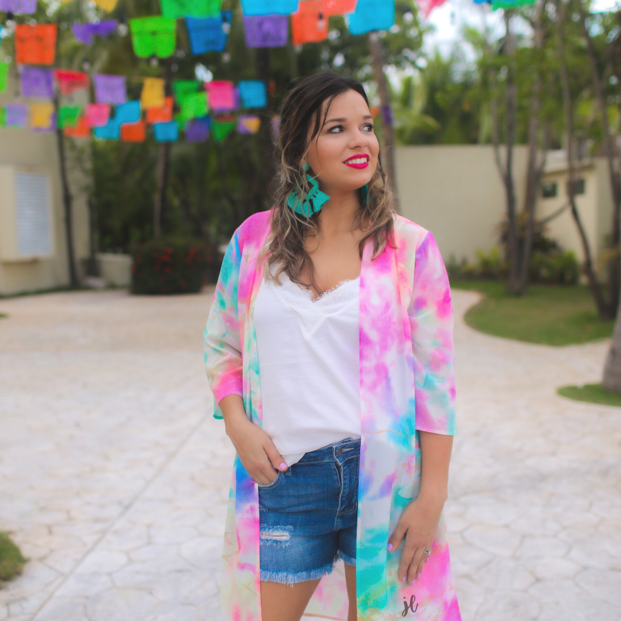 half-sleeve open front kimono made of lightweight material with a relaxed fit on a multi-colored tie-dye print pattern fabric