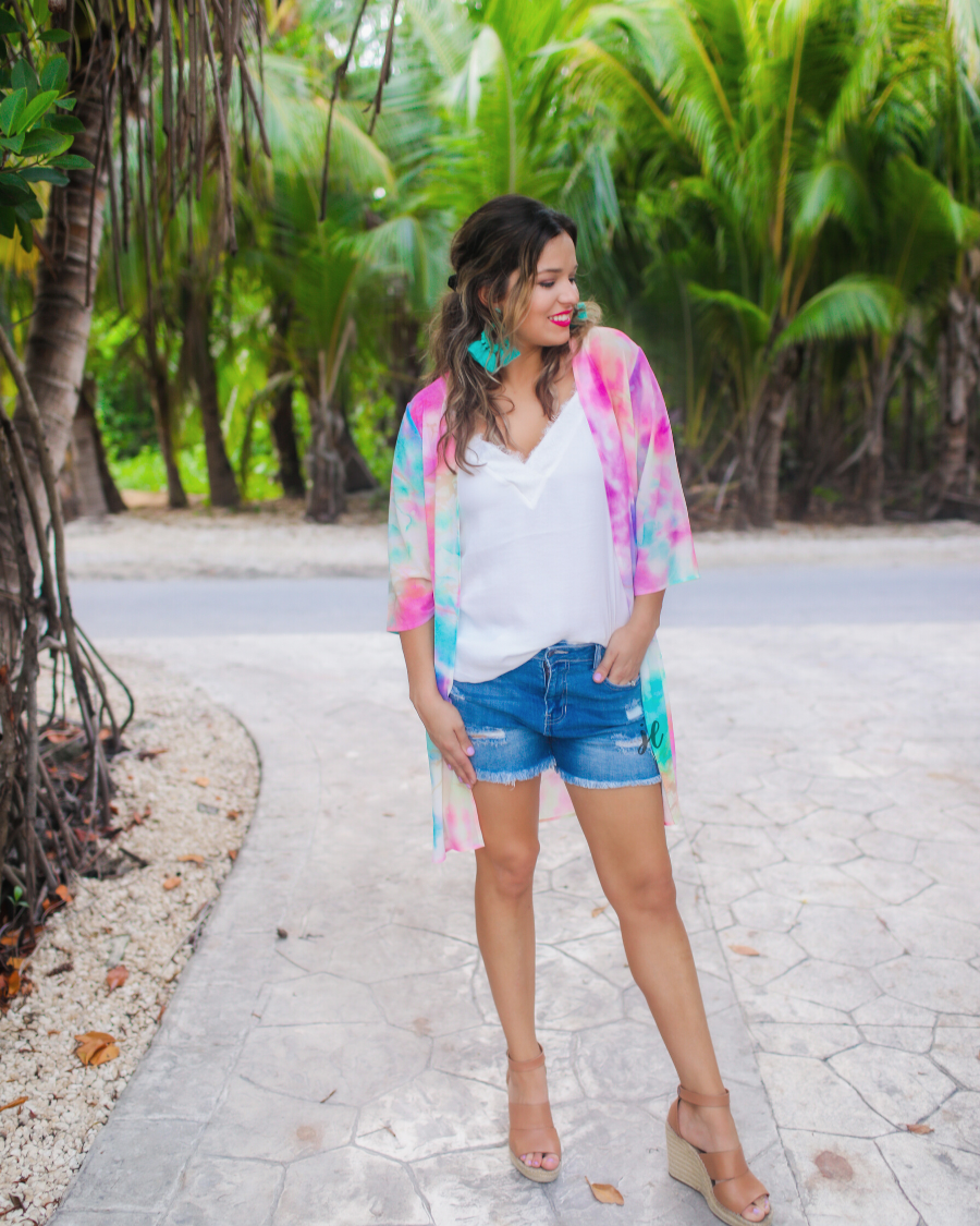 half-sleeve open front kimono made of lightweight material with a relaxed fit on a multi-colored tie-dye print pattern fabric