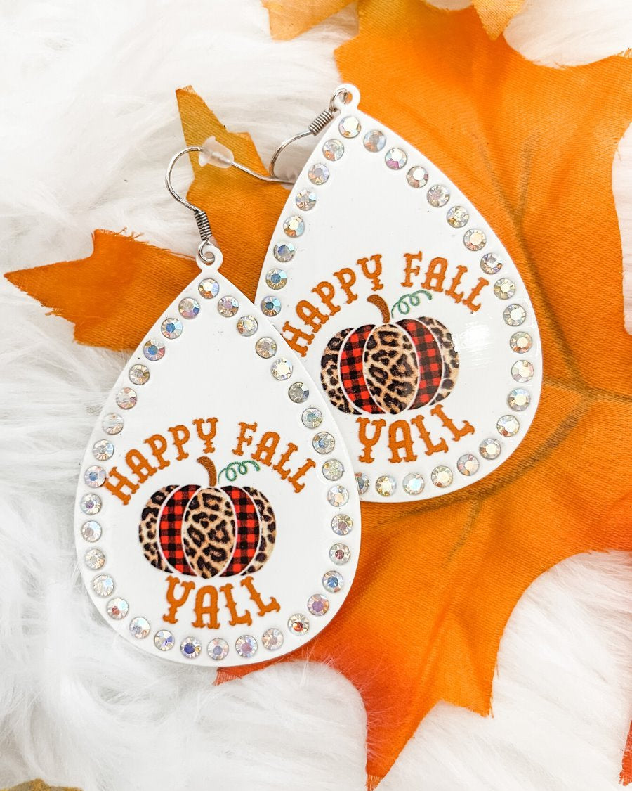 lightweight, seasonal-inspired leopard-theme teardrop-shaped earrings outlined in rhinestones with a fish hook in white leopard pumpkin