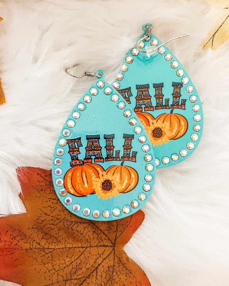 lightweight, seasonal-inspired leopard-theme teardrop-shaped earrings outlined in rhinestones with a fish hook in teal serape pumpkin