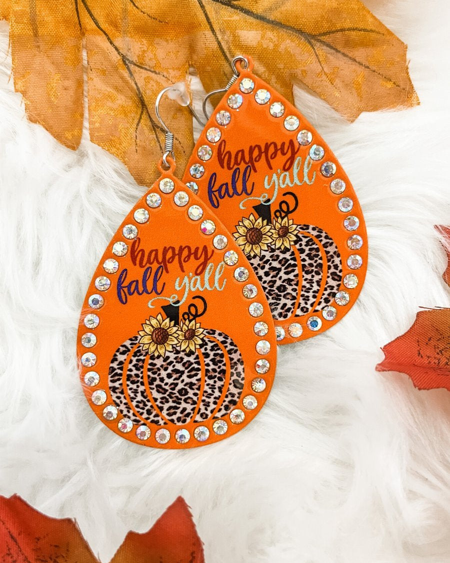 lightweight, seasonal-inspired leopard-theme teardrop-shaped earrings outlined in rhinestones with a fish hook in orange leopard pumpkin