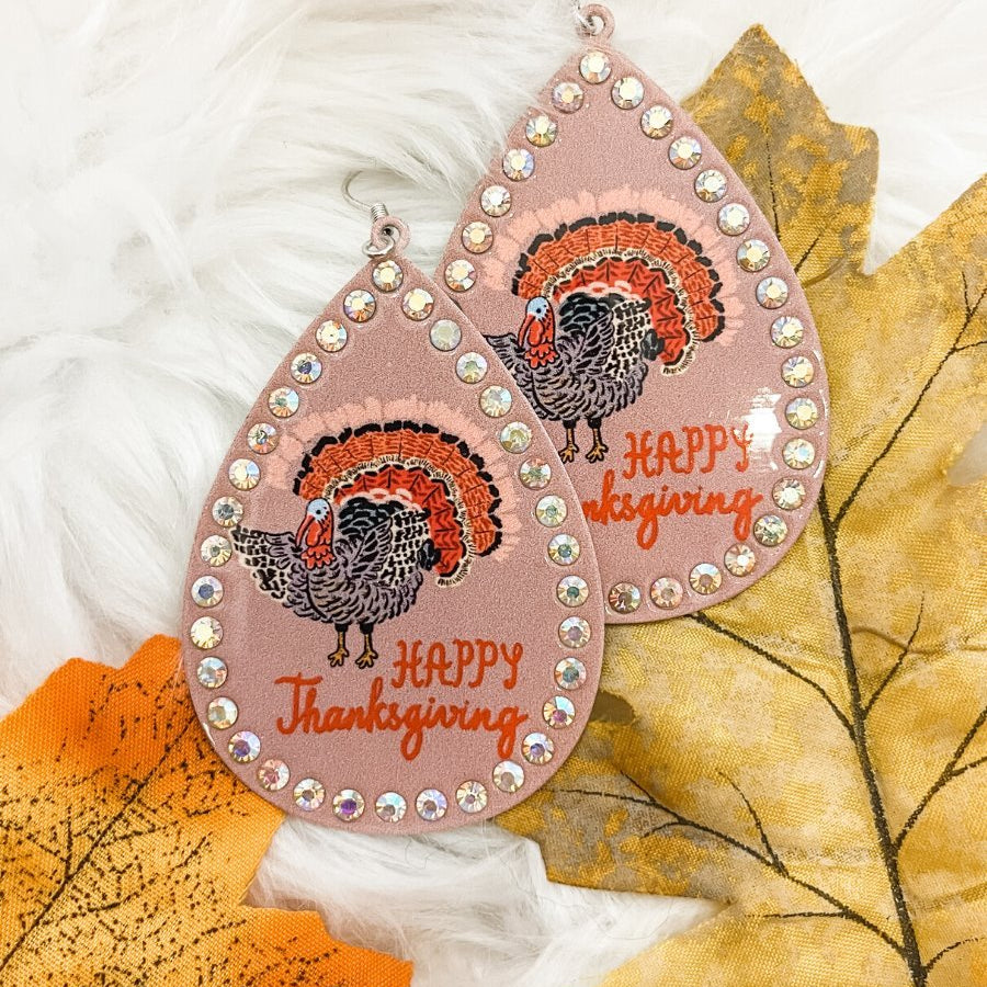lightweight, seasonal-inspired leopard-theme teardrop-shaped earrings outlined in rhinestones with a fish hook in mauve leopard pumpkin