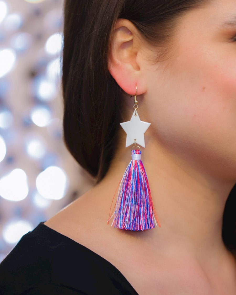 ultra-lightweight hook-style drop earring with a white star topper cascading down into a soft red, white, and blue tassel mix and gold accent