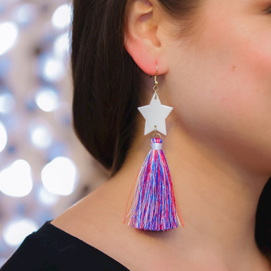 ultra-lightweight hook-style drop earring with a white star topper cascading down into a soft red, white, and blue tassel mix and gold accent