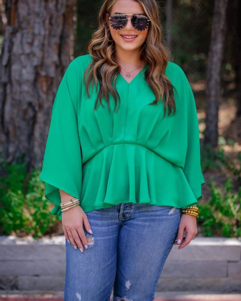 dolman long sleeves top with a plunging v-neckline and a gathered waistline in green