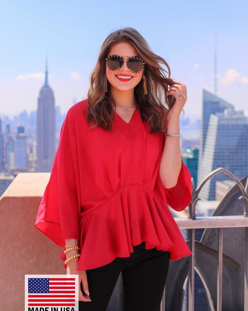 dolman long sleeves top with a plunging v-neckline and a gathered waistline in red