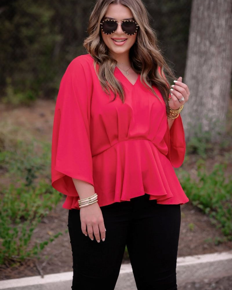 dolman long sleeves top with a plunging v-neckline and a gathered waistline in red