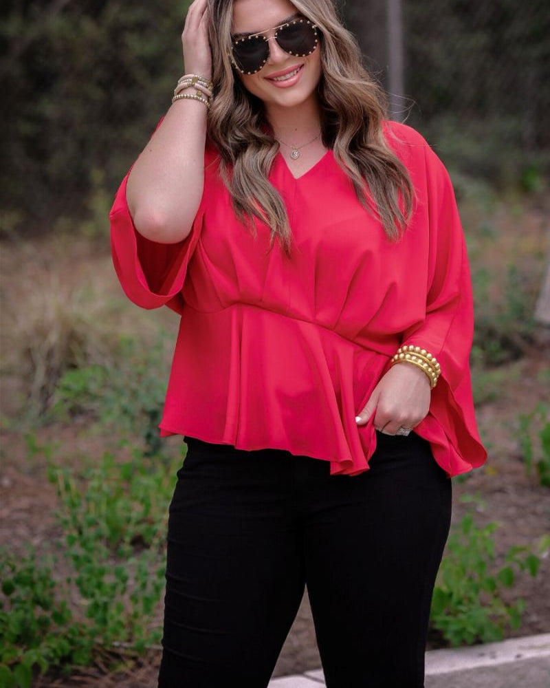 dolman long sleeves top with a plunging v-neckline and a gathered waistline in red