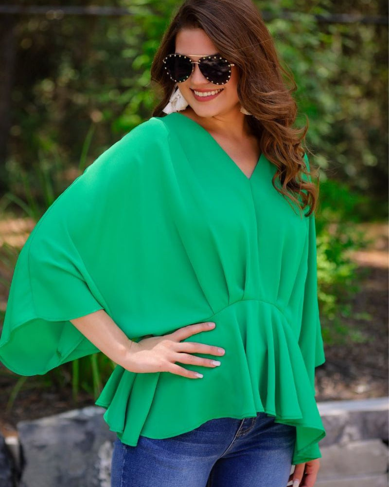 dolman long sleeves top with a plunging v-neckline and a gathered waistline in green