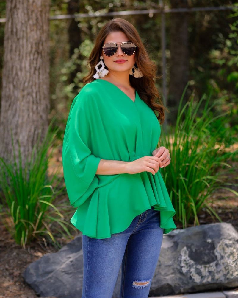 dolman long sleeves top with a plunging v-neckline and a gathered waistline in green