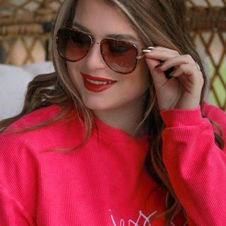 brown aviator sunglasses with thin round wireframes, tinted lenses, UV protection, and brand name detail (on both the temple and the complimentary black pouch)