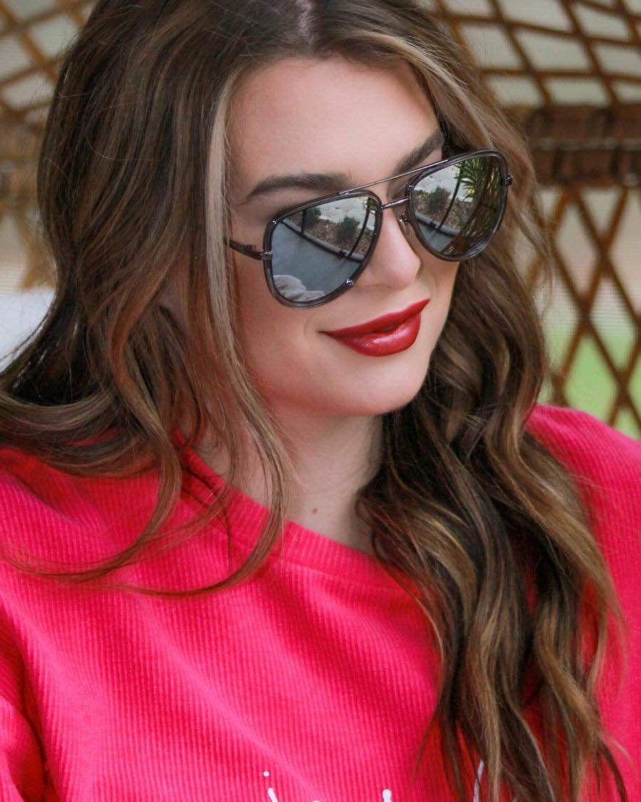 silver aviator sunglasses with thin round wireframes, tinted lenses, UV protection, and brand name detail (on both the temple and the complimentary black pouch)