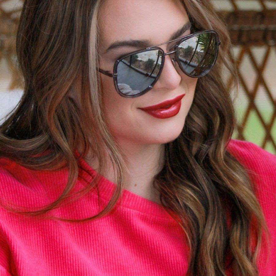 silver aviator sunglasses with thin round wireframes, tinted lenses, UV protection, and brand name detail (on both the temple and the complimentary black pouch)