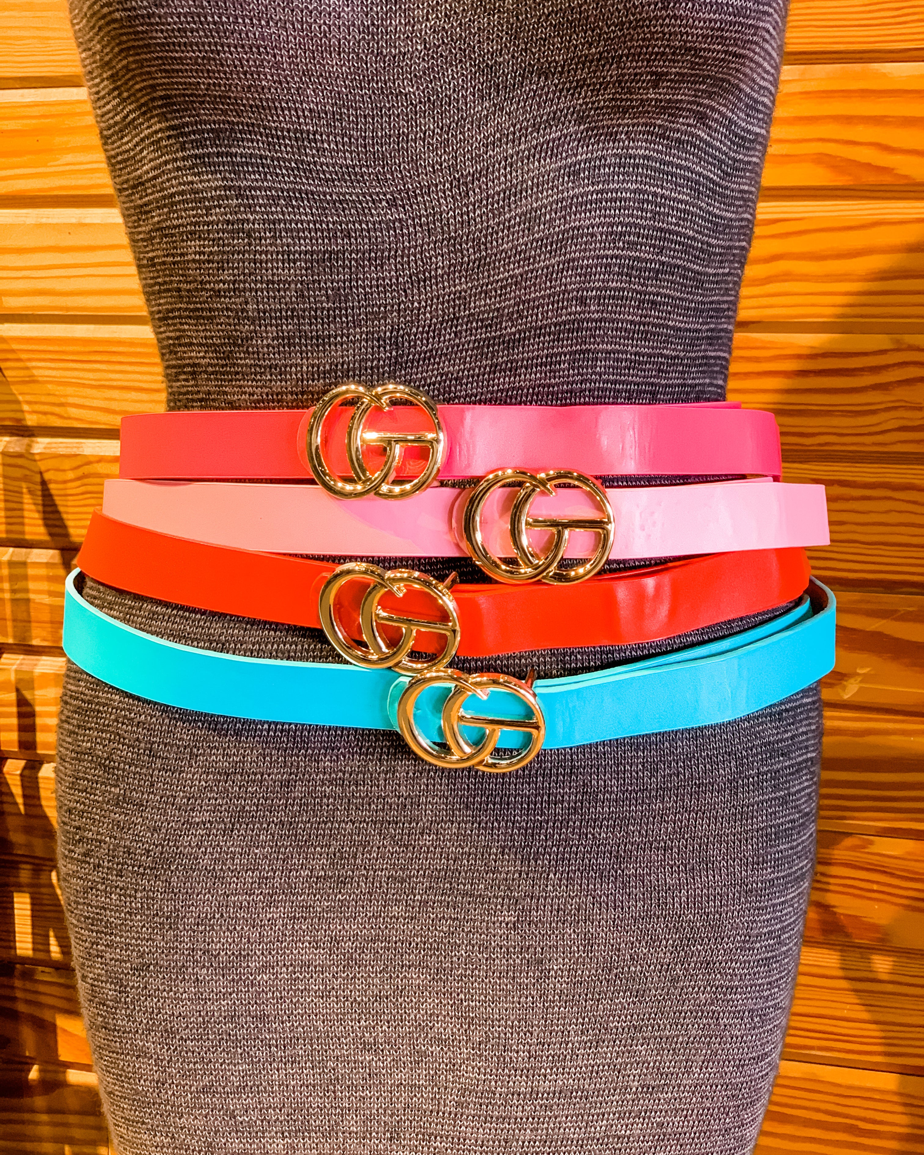 double metal ring faux leather buckle belt in hot pink, light pink, red, and turquoise
