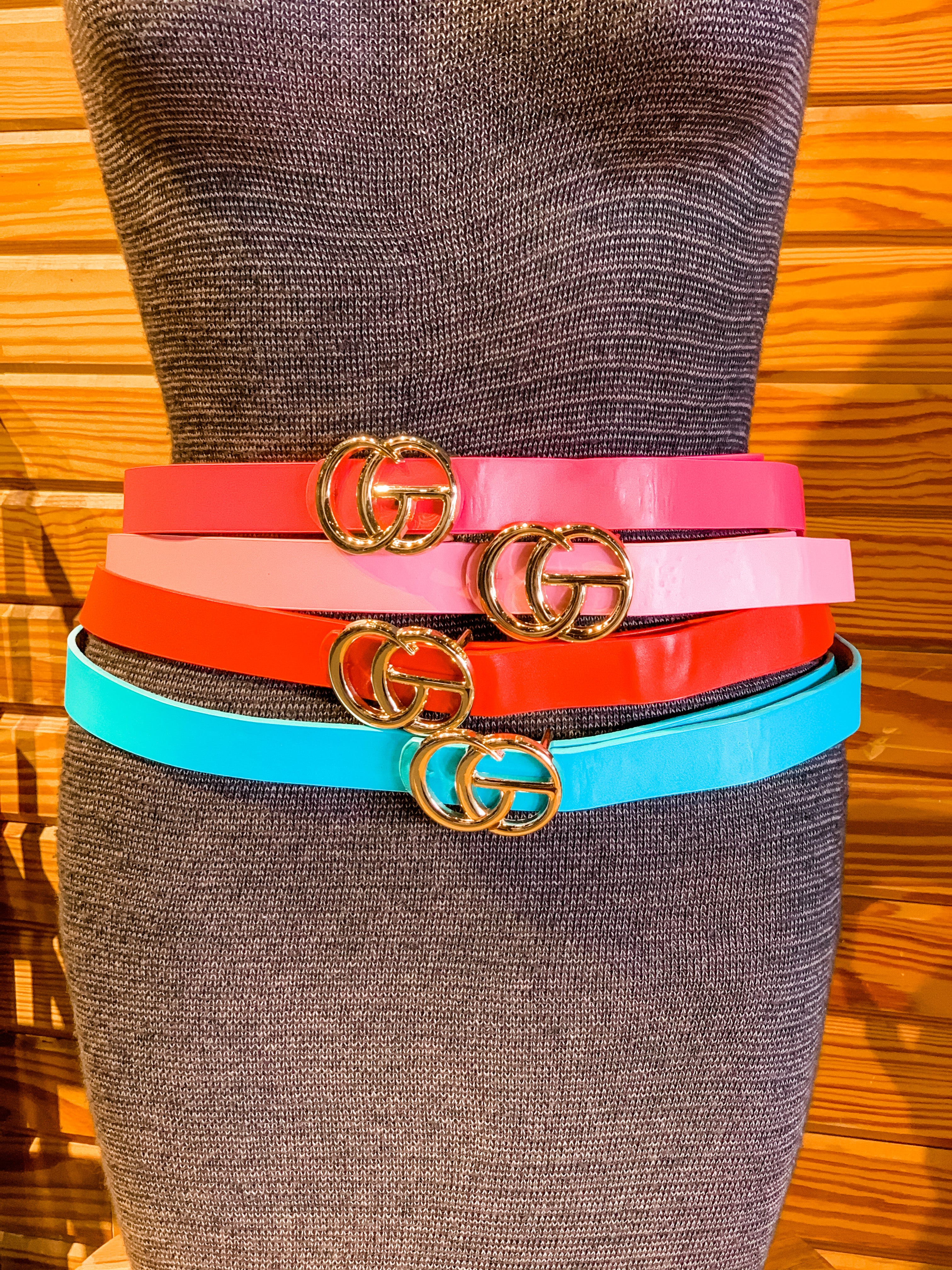 double metal ring faux leather buckle belt in hot pink, light pink, red, and turquoise