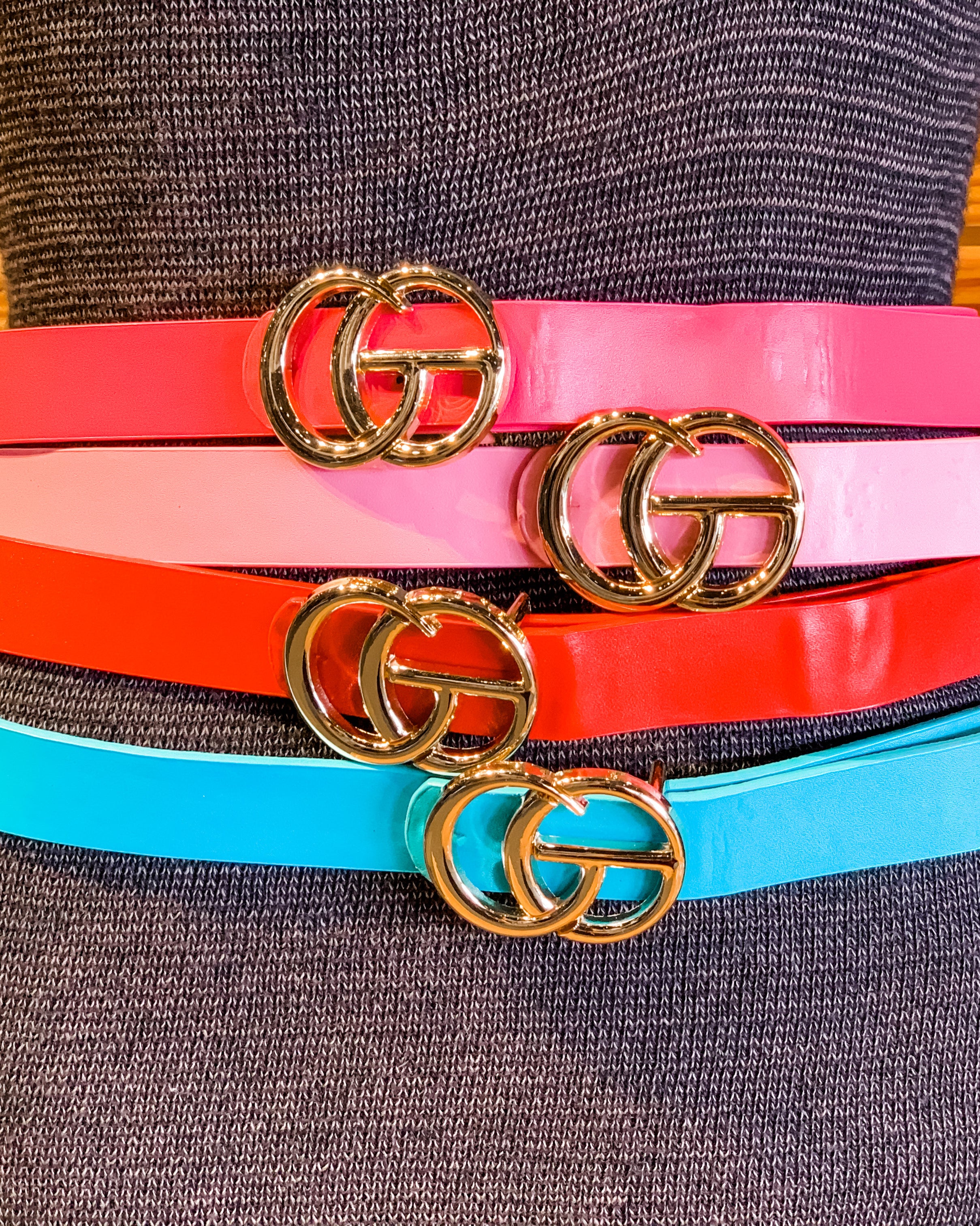 double metal ring faux leather buckle belt in hot pink, light pink, red, and turquoise
