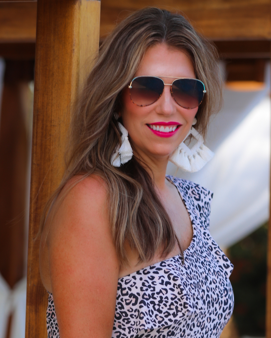 brown aviator sunglasses with tinted lenses, round wireframes with matching brow bar, leopard-patterned accents, UV protection, and brand detail (on both the temple and the complimentary black pouch)