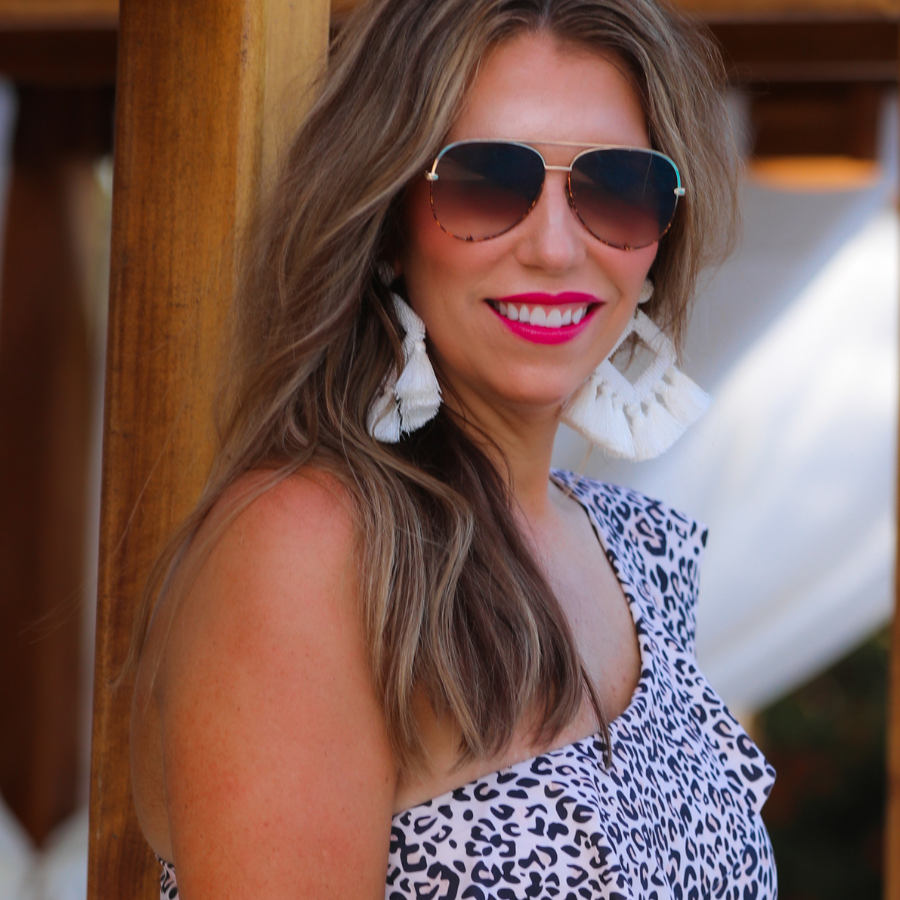 brown aviator sunglasses with tinted lenses, round wireframes with matching brow bar, leopard-patterned accents, UV protection, and brand detail (on both the temple and the complimentary black pouch)