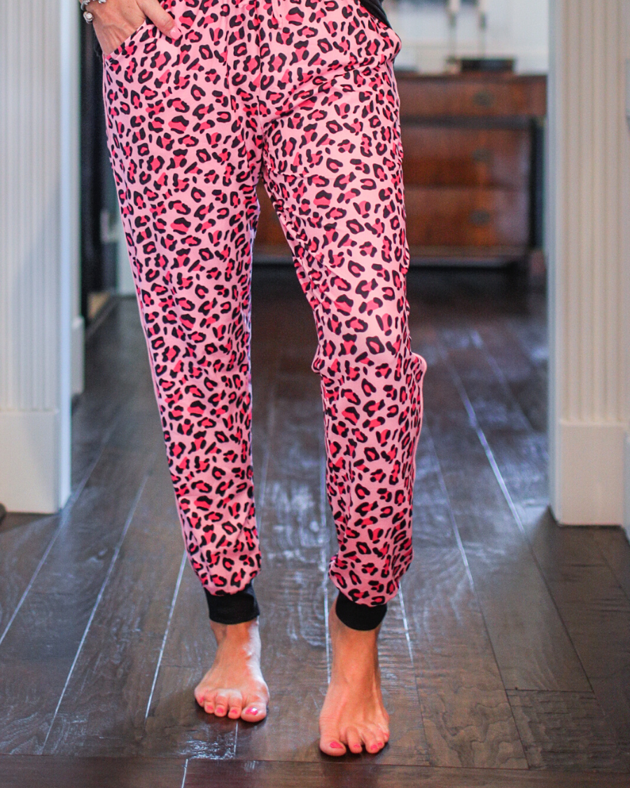 relaxed fit mid-rise joggers with side pockets and a tie waist drawstring, designed on a pink leopard pattern print