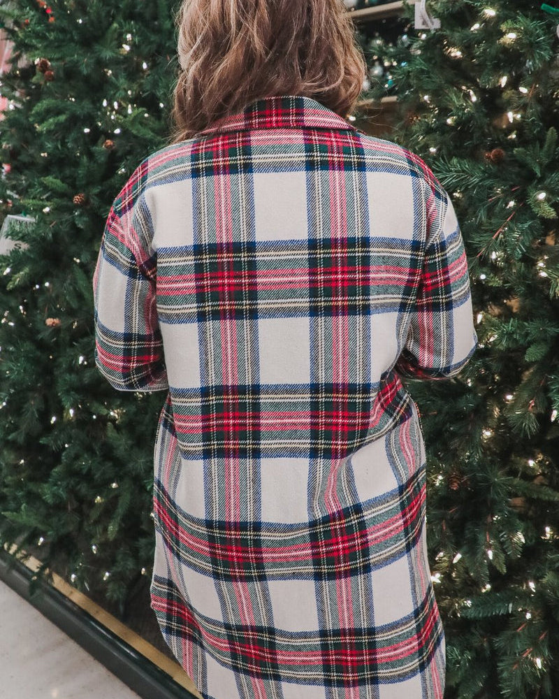 a long-sleeve shacket with a festive plaid print, cuffs, a button-down front to a high-low split hem, a collared neckline, button-closure chest pockets, convenient side pockets on a seasonal plaid print warm fabric