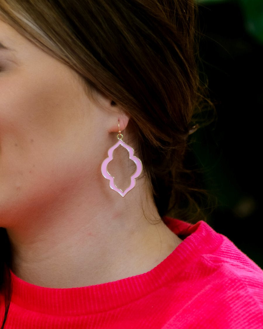 quatrefoil-shaped hook earrings with colored enamel centers in pink