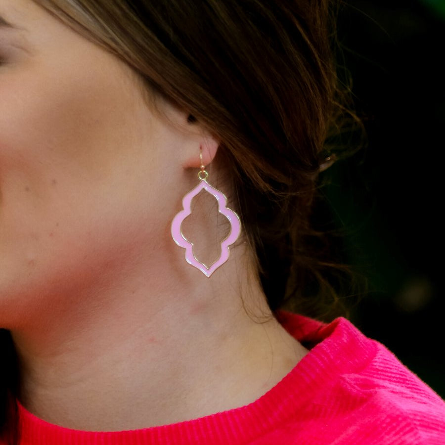 quatrefoil-shaped hook earrings with colored enamel centers in pink