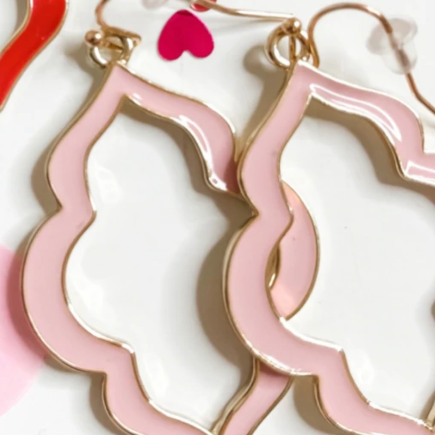 quatrefoil-shaped hook earrings with colored enamel centers in pink