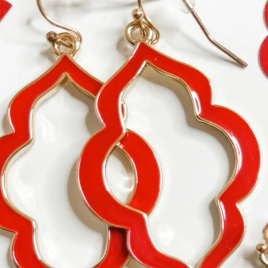 quatrefoil-shaped hook earrings with colored enamel centers in red
