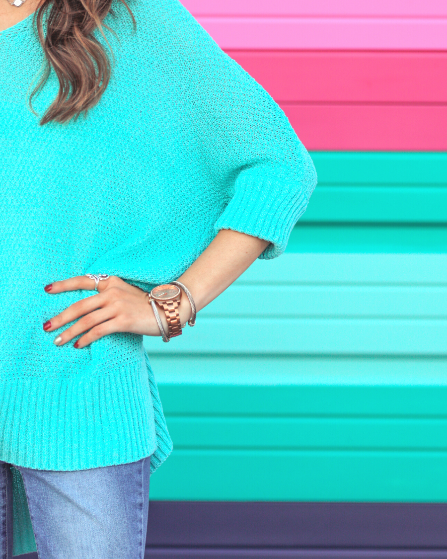 lightweight oversized tunic made of loosely knitted material with three-quarter sleeves, a hi-lo hemline, side slits, and a relaxed drape for easy, all-day wear in aqua