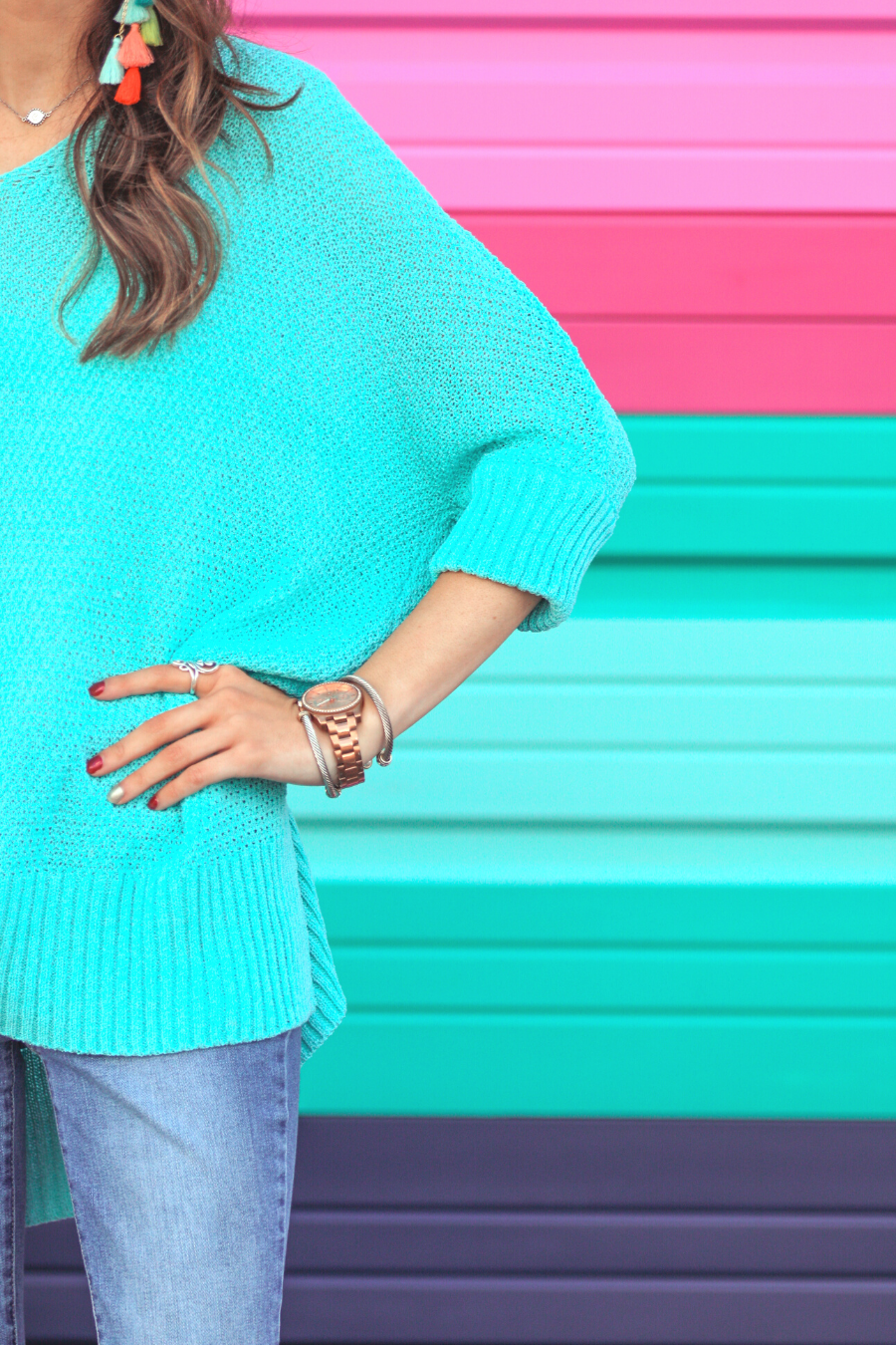 lightweight oversized tunic made of loosely knitted material with three-quarter sleeves, a hi-lo hemline, side slits, and a relaxed drape for easy, all-day wear in aqua