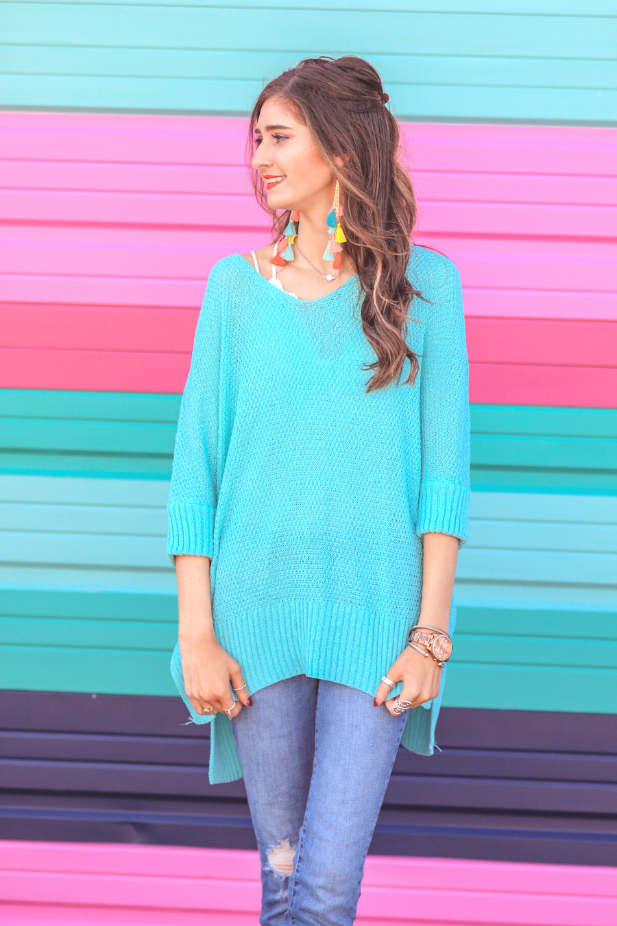 lightweight oversized tunic made of loosely knitted material with three-quarter sleeves, a hi-lo hemline, side slits, and a relaxed drape for easy, all-day wear in aqua