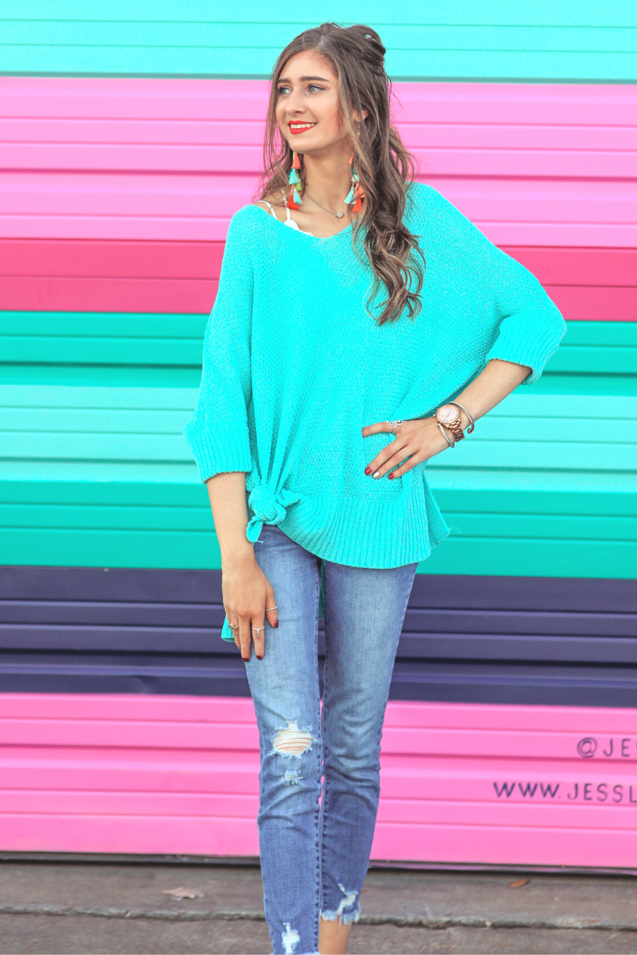 lightweight oversized tunic made of loosely knitted material with three-quarter sleeves, a hi-lo hemline, side slits, and a relaxed drape for easy, all-day wear in aqua