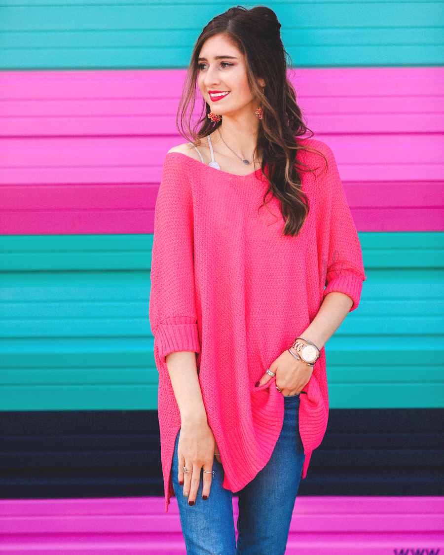 lightweight oversized tunic made of loosely knitted material with three-quarter sleeves, a hi-lo hemline, side slits, and a relaxed drape for easy, all-day wear in pink