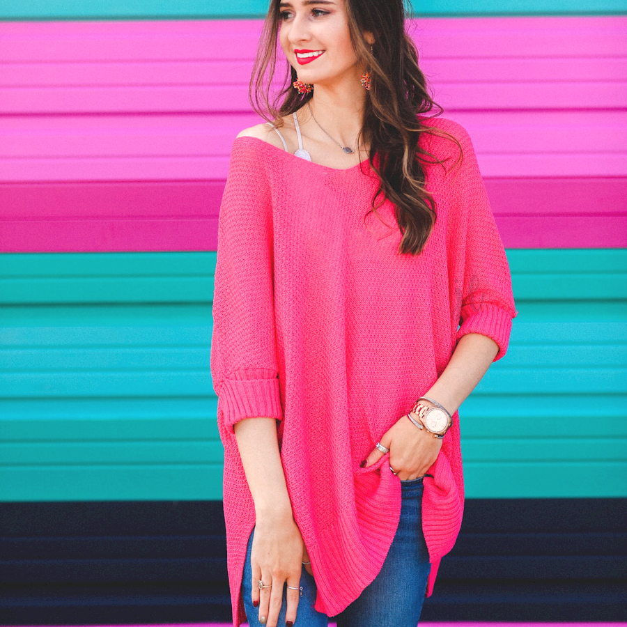 lightweight oversized tunic made of loosely knitted material with three-quarter sleeves, a hi-lo hemline, side slits, and a relaxed drape for easy, all-day wear in pink