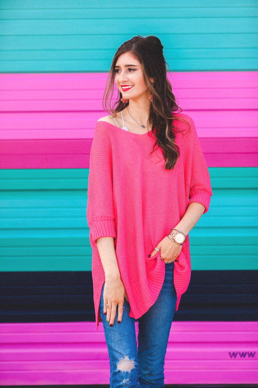 lightweight oversized tunic made of loosely knitted material with three-quarter sleeves, a hi-lo hemline, side slits, and a relaxed drape for easy, all-day wear in pink
