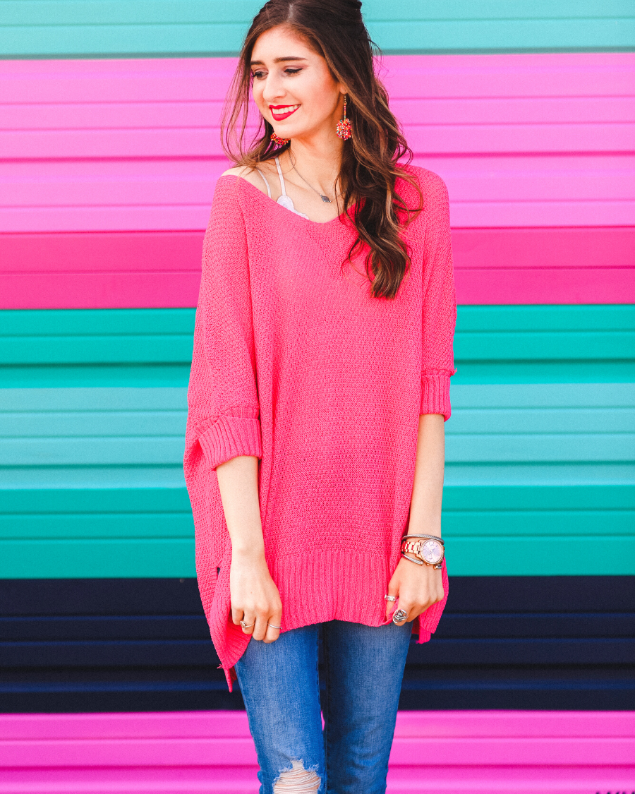 lightweight oversized tunic made of loosely knitted material with three-quarter sleeves, a hi-lo hemline, side slits, and a relaxed drape for easy, all-day wear in pink
