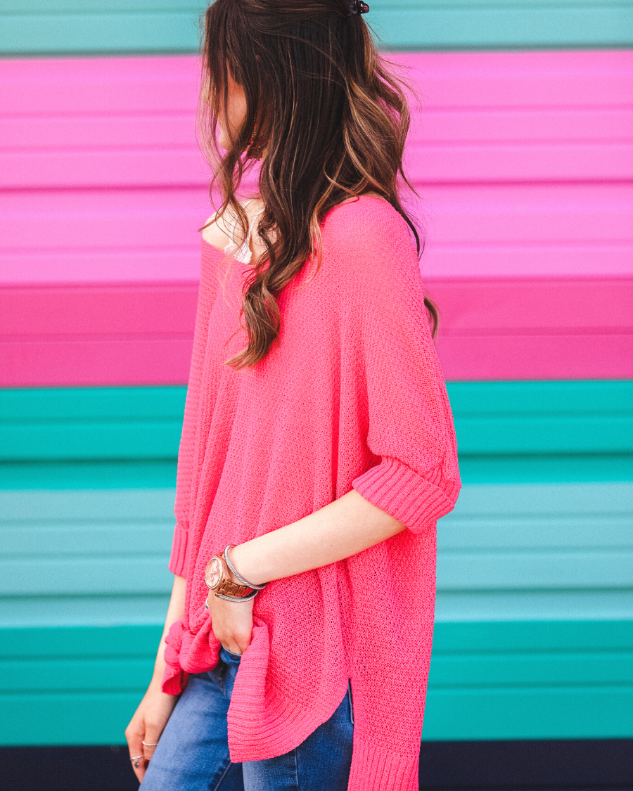lightweight oversized tunic made of loosely knitted material with three-quarter sleeves, a hi-lo hemline, side slits, and a relaxed drape for easy, all-day wear in pink