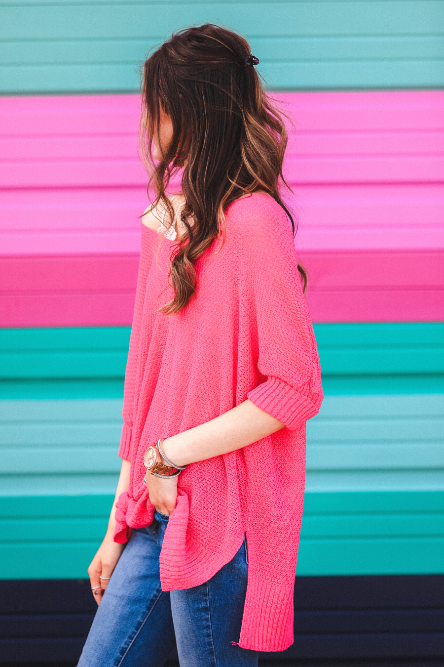 lightweight oversized tunic made of loosely knitted material with three-quarter sleeves, a hi-lo hemline, side slits, and a relaxed drape for easy, all-day wear in pink