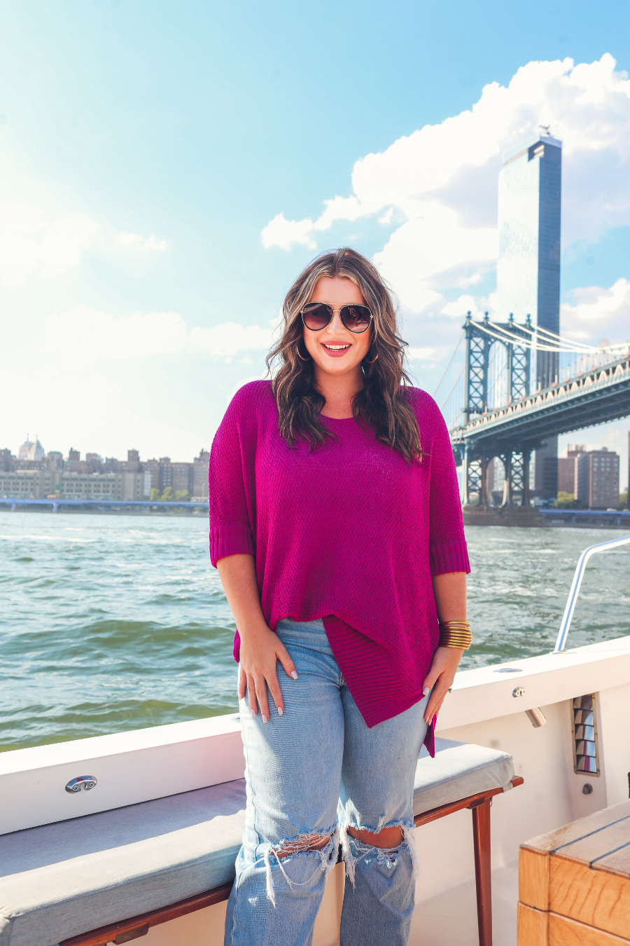 lightweight oversized tunic made of loosely knitted material with three-quarter sleeves, a hi-lo hemline, side slits, and a relaxed drape for easy, all-day wear in magenta