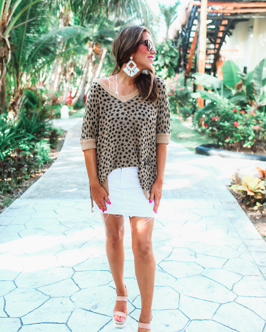 lightweight oversized tunic made of loosely knitted material with three-quarter sleeves, a hi-lo hemline, side slits, and a relaxed drape for easy, all-day wear in leopard