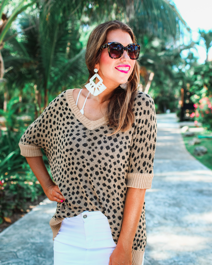 lightweight oversized tunic made of loosely knitted material with three-quarter sleeves, a hi-lo hemline, side slits, and a relaxed drape for easy, all-day wear in leopard