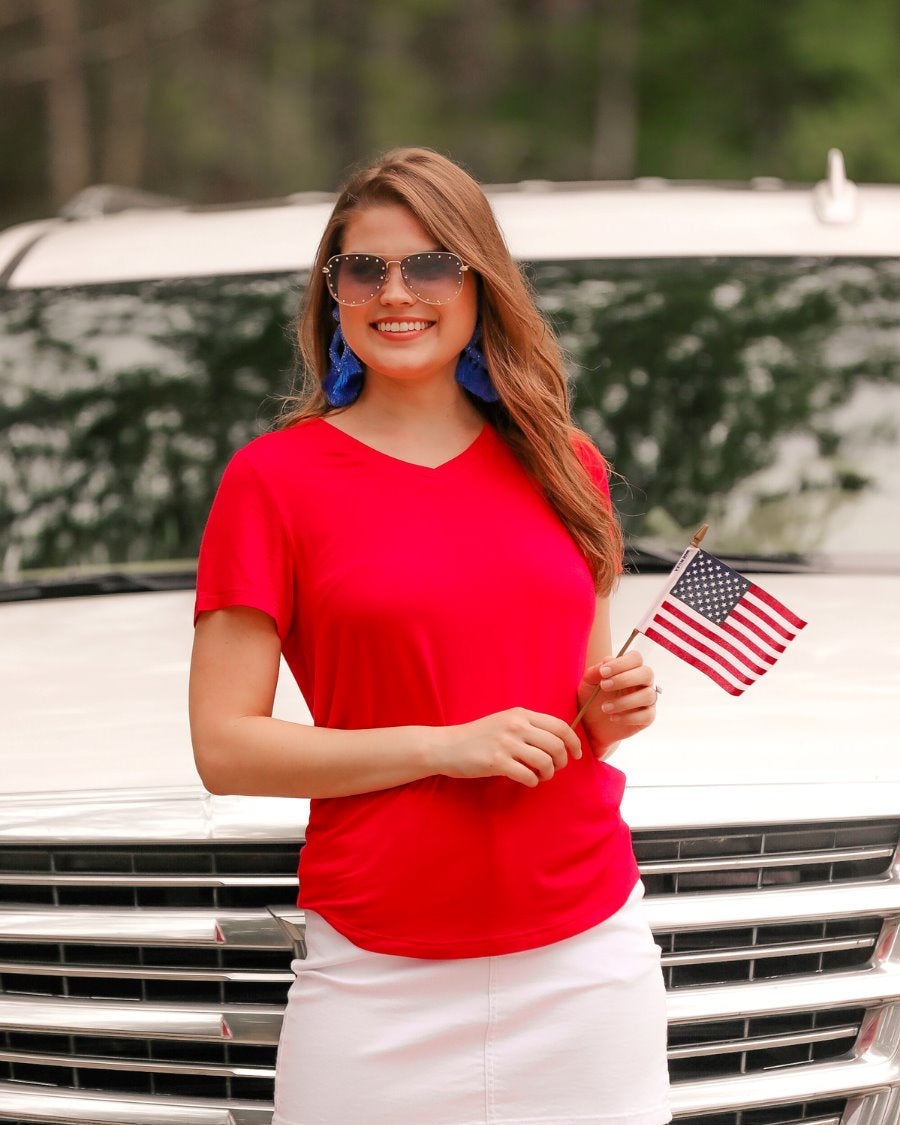 short-sleeved tee made of soft, breathable fabric with a V-neckline and a rounded hemline in red