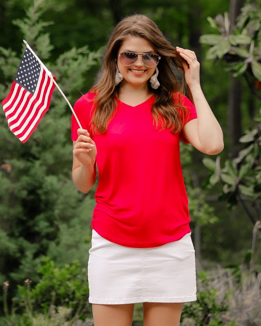 short-sleeved tee made of soft, breathable fabric with a V-neckline and a rounded hemline in red