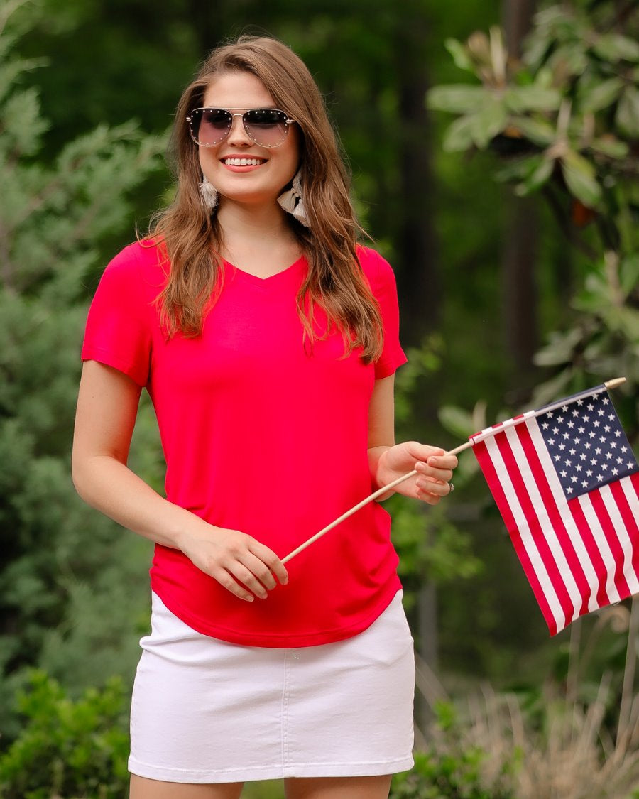 short-sleeved tee made of soft, breathable fabric with a V-neckline and a rounded hemline in red
