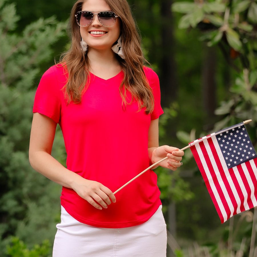 short-sleeved tee made of soft, breathable fabric with a V-neckline and a rounded hemline in red